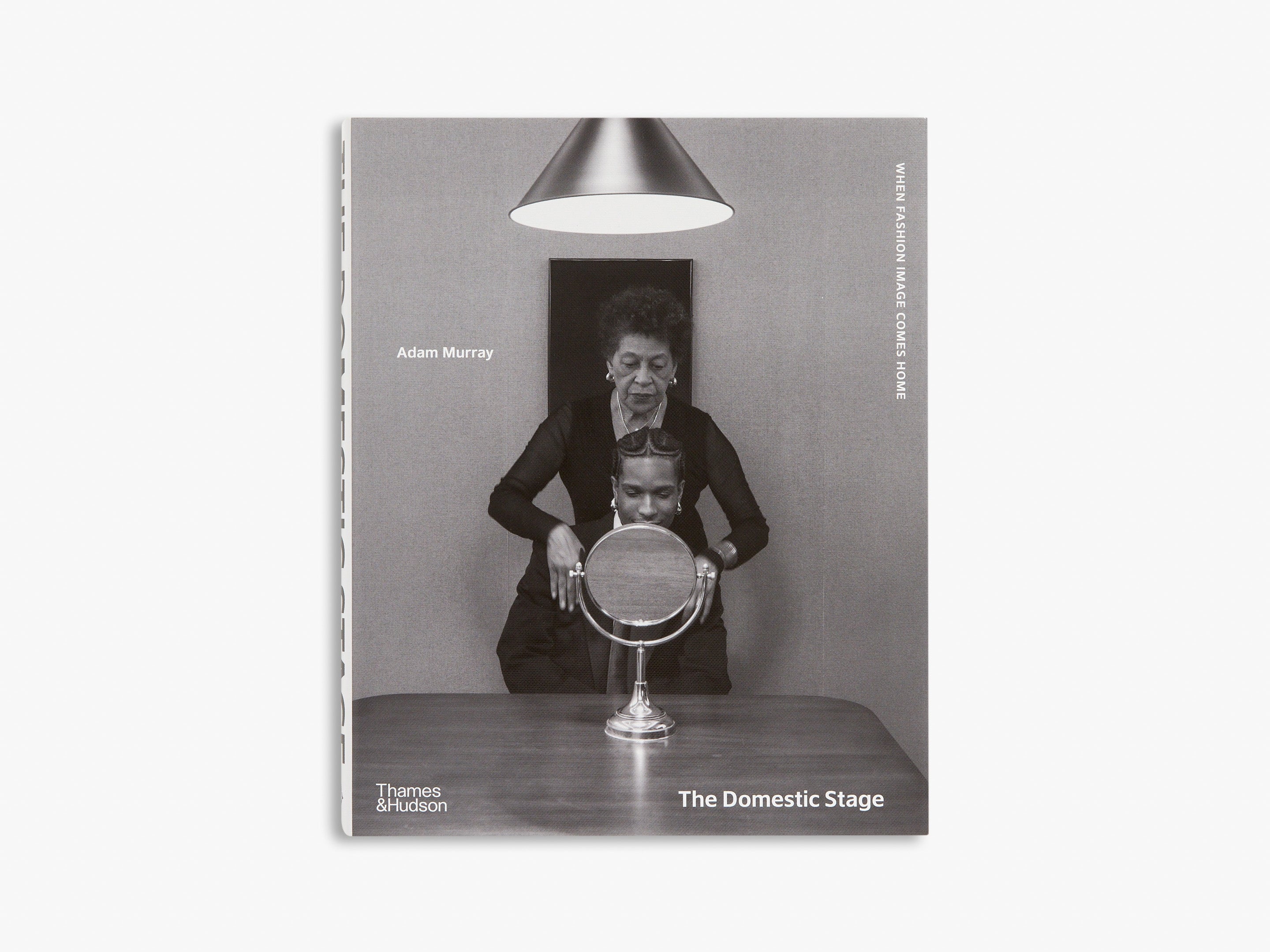 Book cover of 'The Domestic Stage' with a black and white photo of a woman and man with a mirror, on a white background.