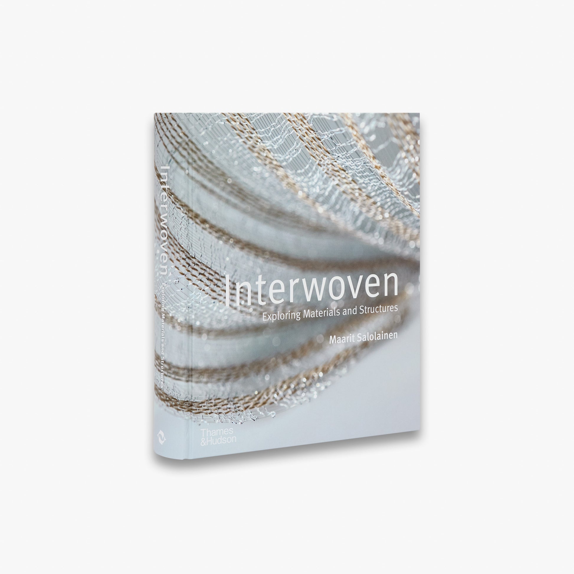 Book titled 'Interwoven' with a close-up of woven material on the cover.