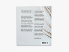 Back cover of a book with text and a barcode on a white background