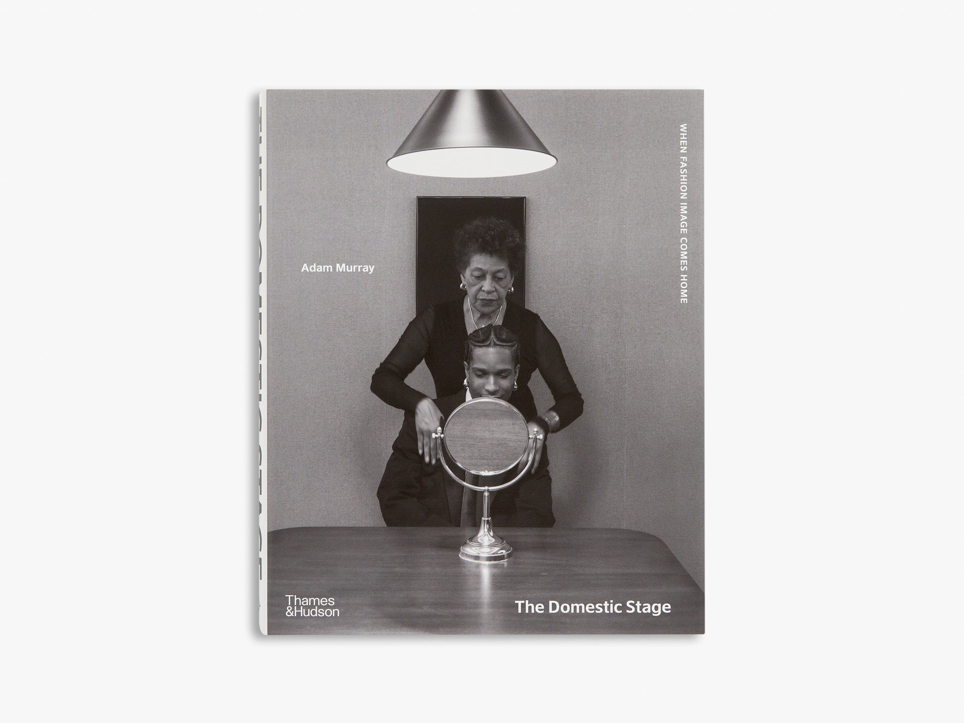 Book cover of 'The Domestic Stage' with a black and white photo of a woman and man with a mirror, on a white background.