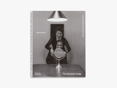 Book cover of 'The Domestic Stage' with a black and white photo of a woman and man with a mirror, on a white background.