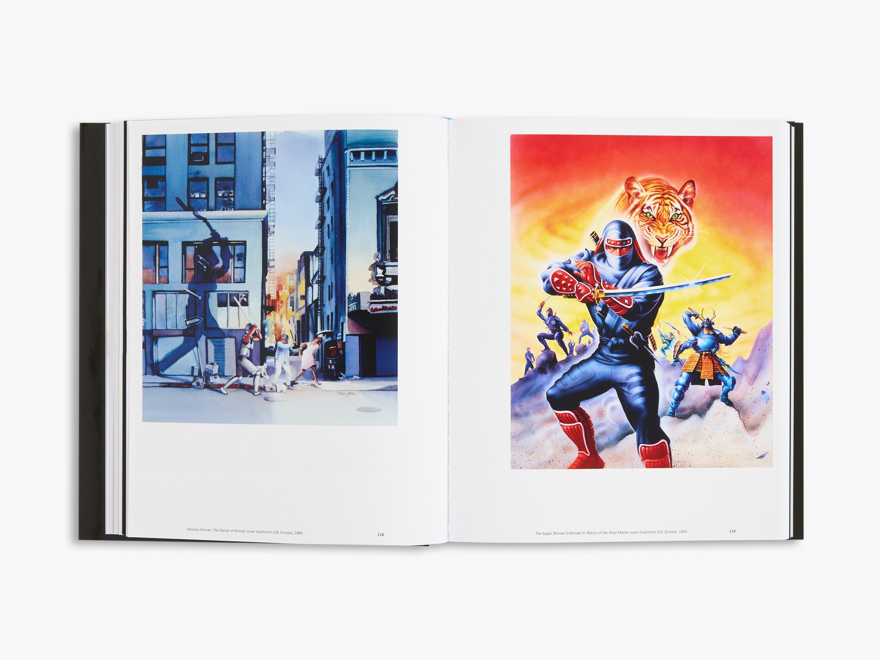 Open book showing two colorful illustrations of action scenes with characters and buildings.