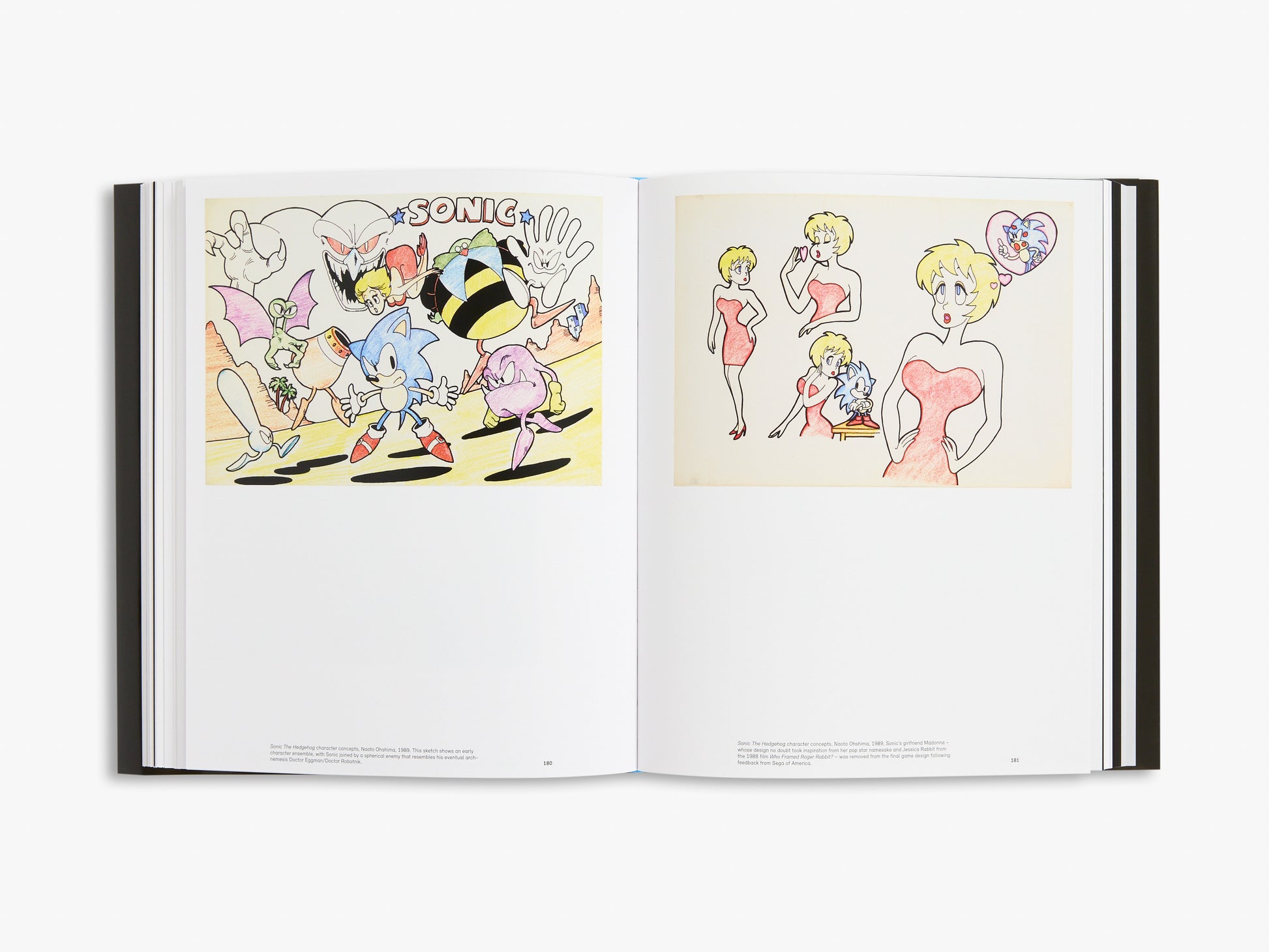 Open book showing animated character designs on a white background