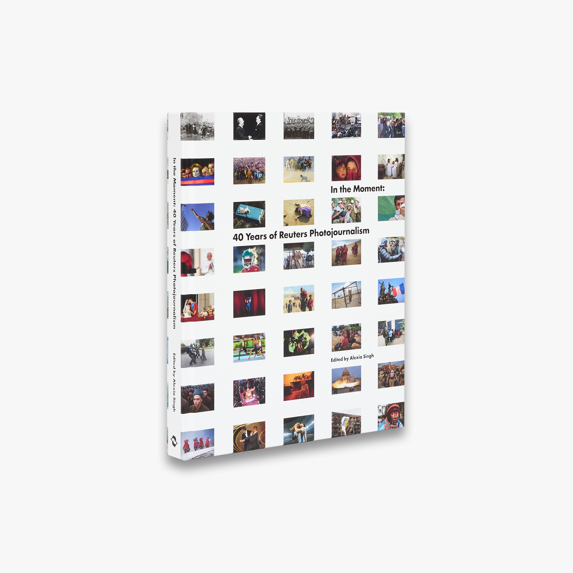Book titled 'In the Moment: 40 Years of Reuters Photojournalism' with collage of photos on a white background