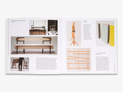 Open book displaying images of furniture and design elements on a white background