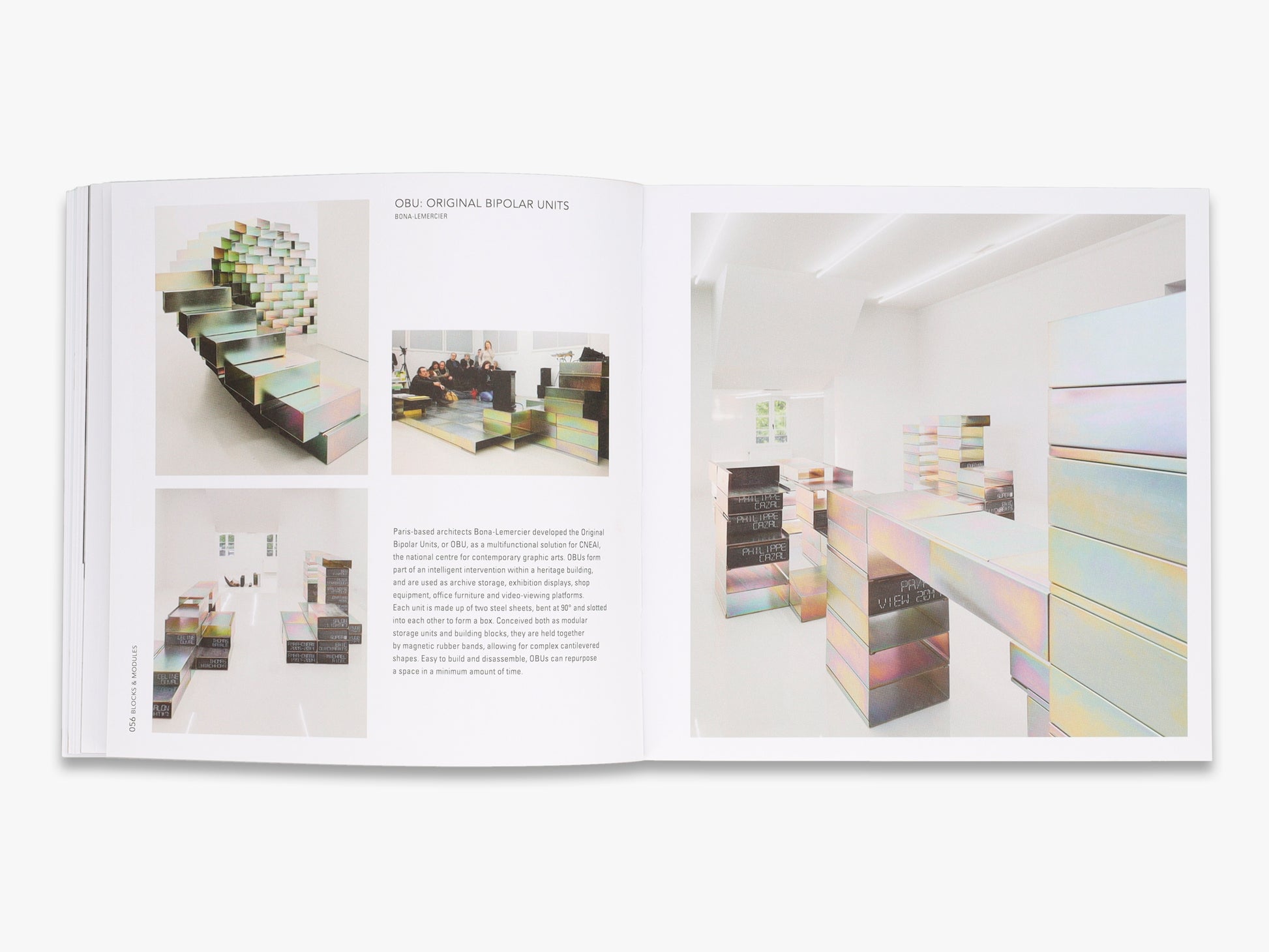 Open book showing interior design images of a modern living room.