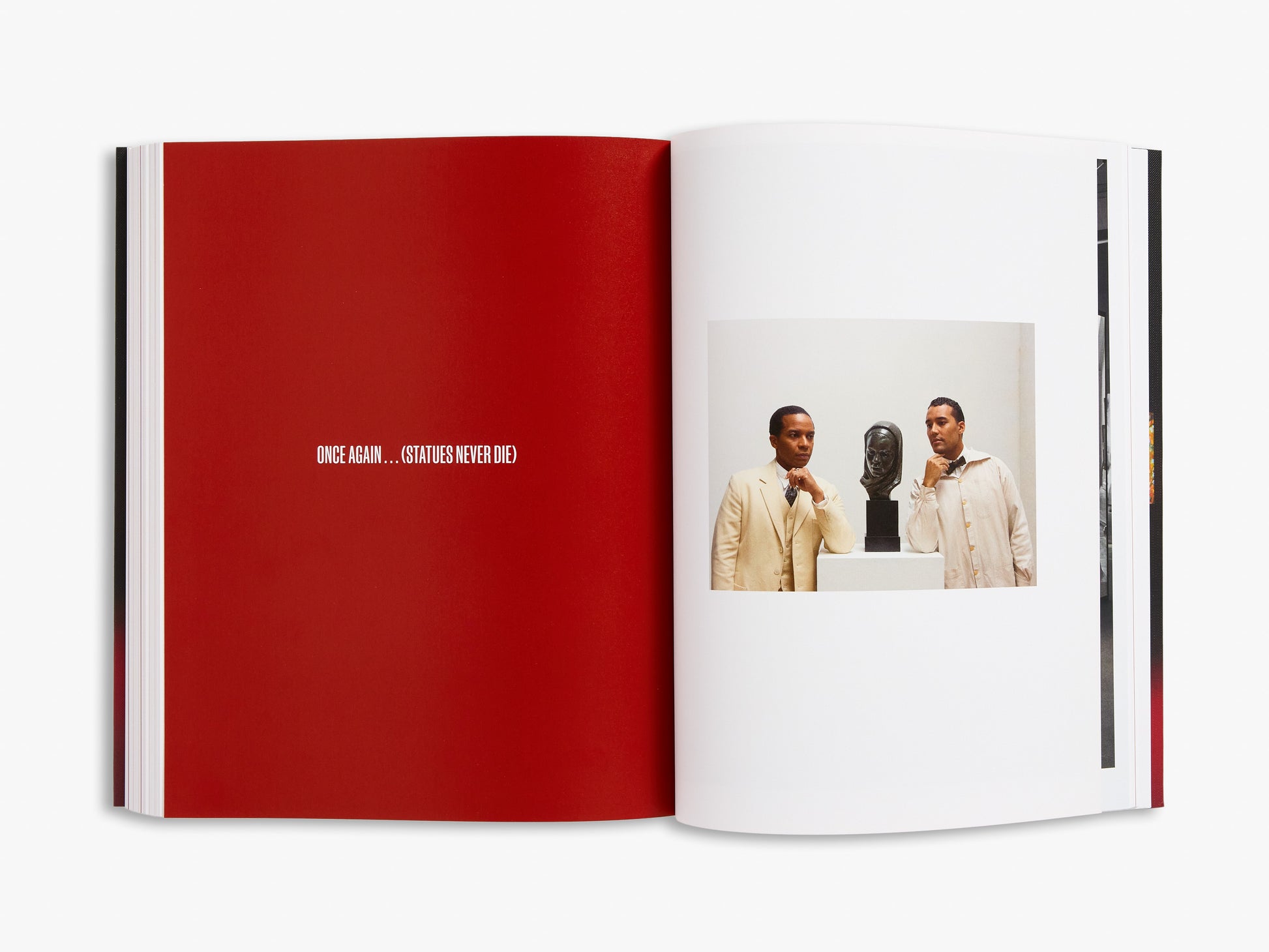 Open book with a red page and a photo of two people on a white background