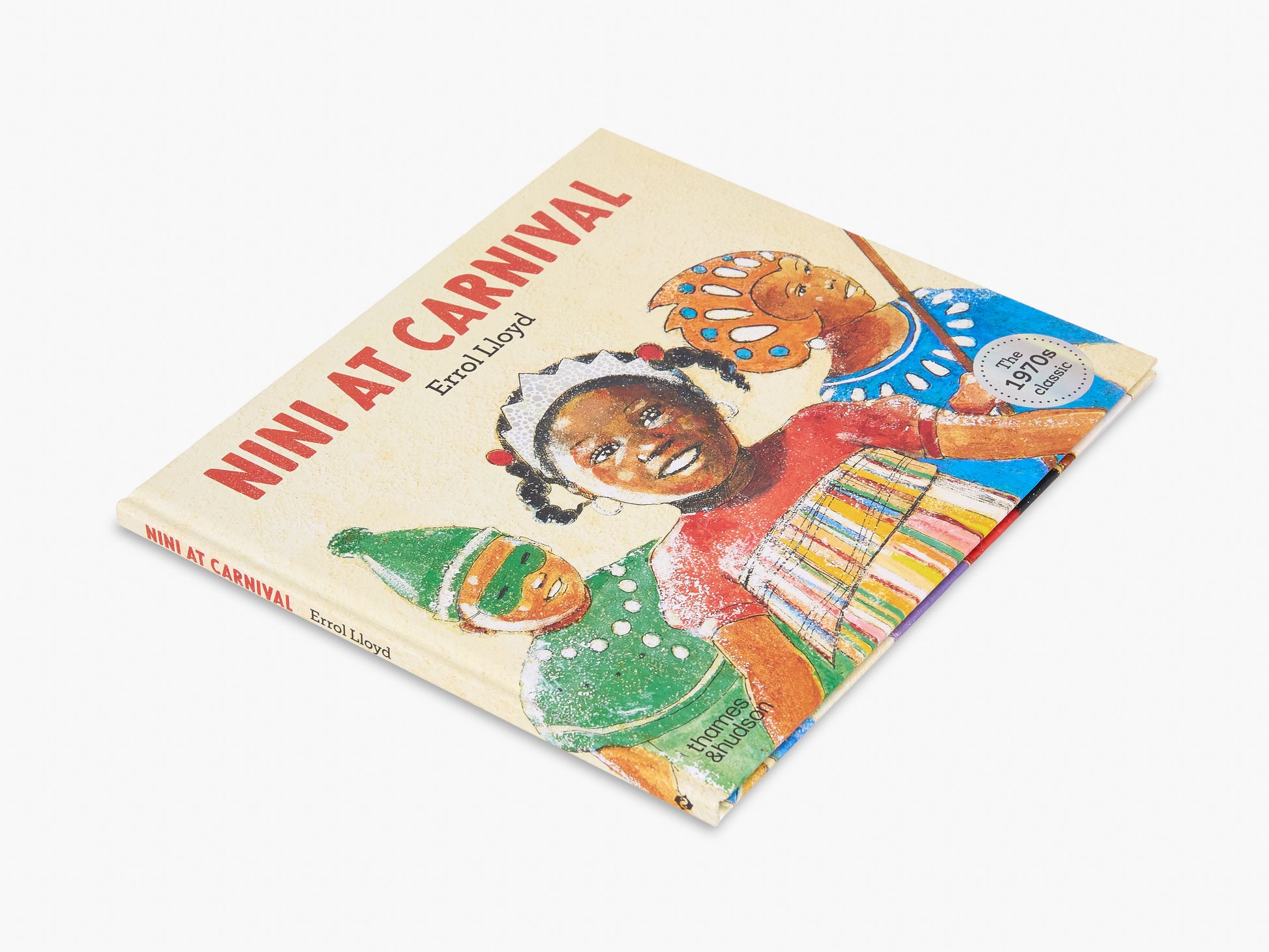 Book titled 'Nini at Carnival' with colorful illustrations on a white background